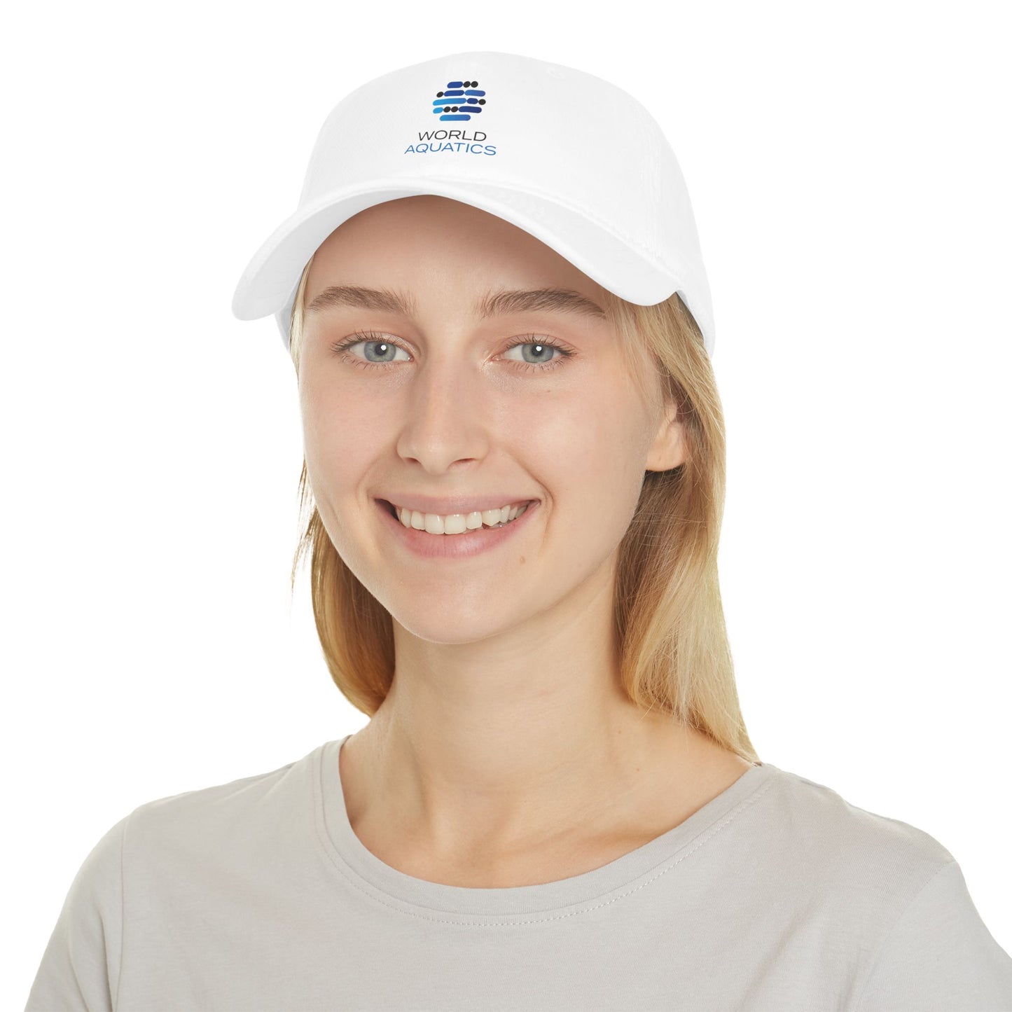 World Aquatics Baseball Cap on model – white low-profile cotton cap with embroidered logo.
