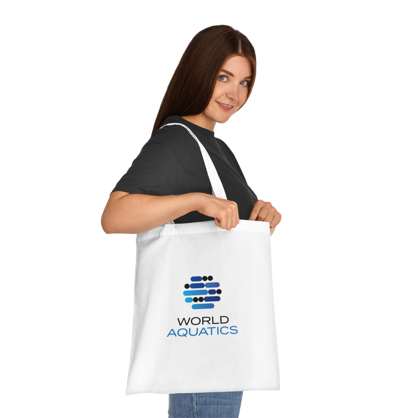 Woman carrying the World Aquatics Cotton Tote Bag – stylish eco-friendly bag made from 100% cotton, perfect for daily use or shopping.