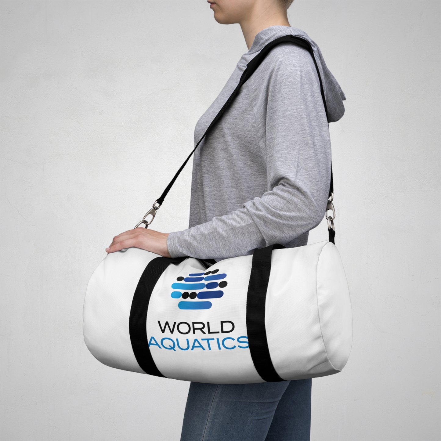 World Aquatics Duffel Bag on shoulder – stylish and durable gym or travel bag with logo print.