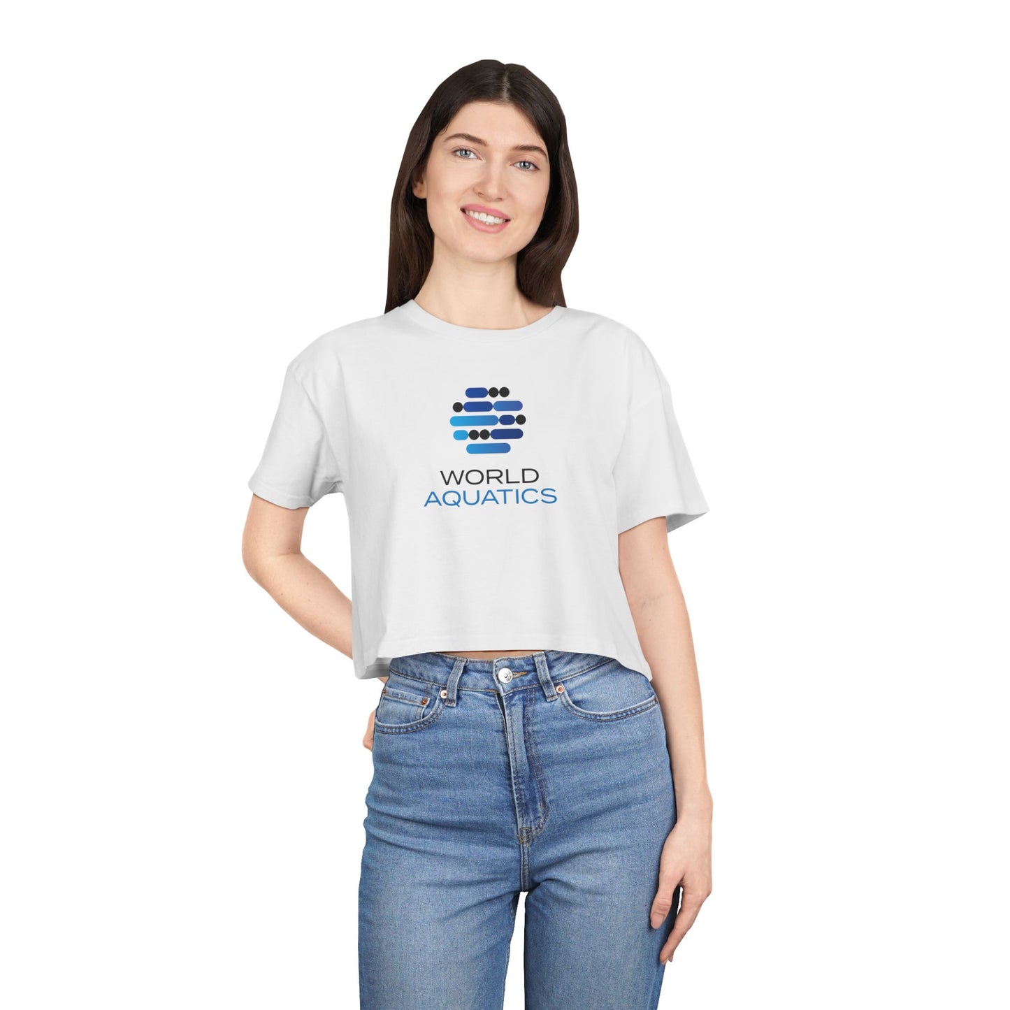Woman wearing World Aquatics Women’s Cropped T-Shirt – relaxed fit crop top with logo, perfect for casual summer looks.