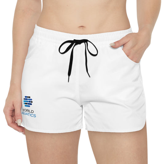 Woman wearing World Aquatics Performance Shorts – lightweight, breathable sports shorts with World Aquatics logo and drawstring waistband.