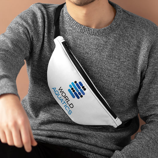 Man wearing the World Aquatics Waist Bag across her chest in outdoor setting – stylish hands-free storage for essentials.